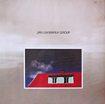 Photo with Blue Sky, White Cloud, Wires, Windows and a Red Roof